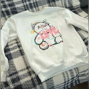 White Sweatshirt with Graphic Design